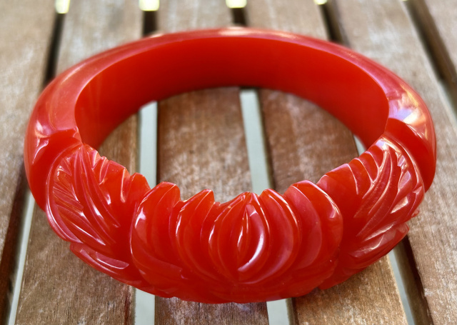 BB567 orange red lotus carved bakelite bangle